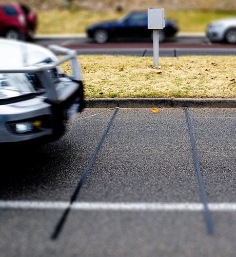 Piezoelectric traffic counter sensor by the side of the road
Photo by Louis van Senden [CC BY-SA 4.0]